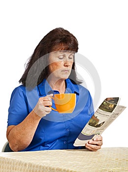 Businesswoman With Newspaper And Drinking Coffee