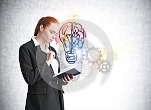 Businesswoman with notebook in hands, gears and light bulb sketch