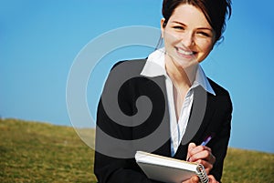 Businesswoman with notepad