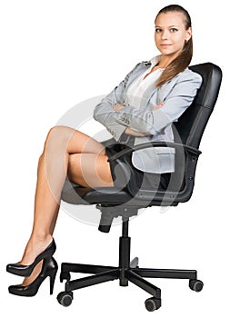 Businesswoman in office chair with straight back