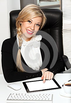 Businesswoman in the office with ipad