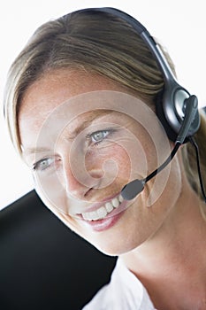 Businesswoman in office wearing headset