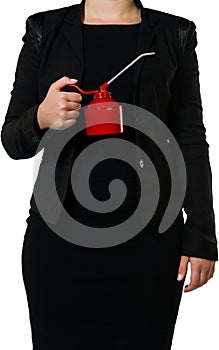 Businesswoman with an oil can