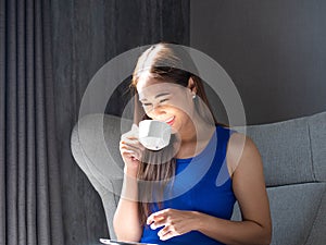 Businesswoman one person young adult hold drink coffee cup hot tea living room office female portrait beautiful smile white