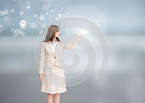 Businesswoman with open hand with bright background