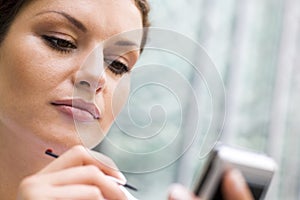 Businesswoman with palmtop