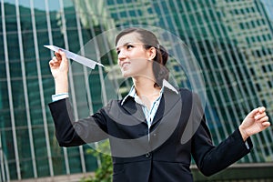 Businesswoman with Paper Plane