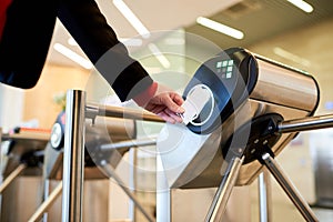 Businesswoman Passing Turnstile