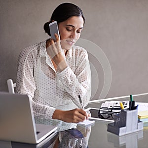 Businesswoman, phone call and office with laptop, desk and cellphone in meeting. Technology, computer and writing notes