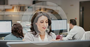 Businesswoman, phone and internet connection in office, scrolling and browsing on website for research. Female person