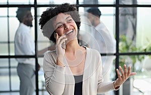 Businesswoman with phone in modern office photo