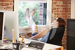 Businesswoman On Phone Relaxing In Modern Creative Office