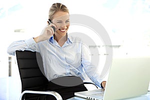 Businesswoman on the phone at workplace