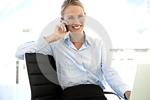 Businesswoman on the phone at workplace