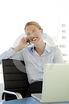 Businesswoman on the phone at workplace