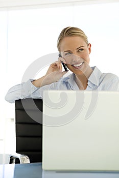 Businesswoman on the phone at workplace