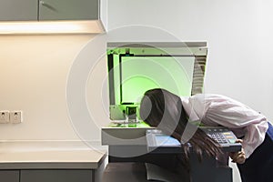 Businesswoman Photocopying Her Face