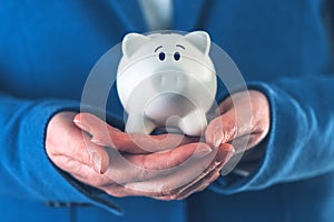 Businesswoman with piggy coin bank