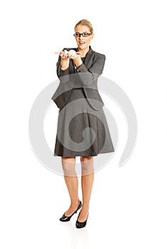 Businesswoman with plane toy in hand