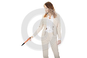 Businesswoman pointing down with pen.