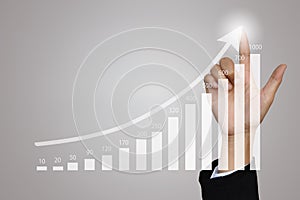 Businesswoman pointing at growing graph concept for business success, investment, financial, future technology and money and