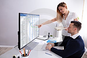 Businesswoman Pointing At Screen While Analyzing Gantt Chart