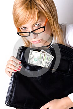 Businesswoman with portfolio and money