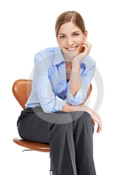 Businesswoman, portrait and sitting on chair in studio, white background and happiness. Happy female worker, model and
