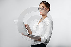 Businesswoman portrait in studio with gray background
