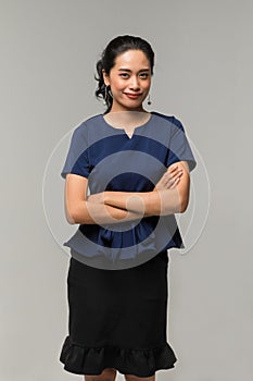 Businesswoman posing and points her index finger