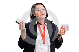 Businesswoman presenting credit or debit card and cash money