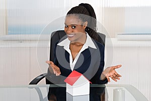 Businesswoman Presenting A House Model