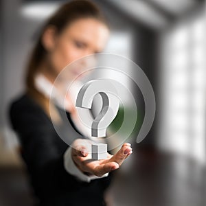 Businesswoman presenting a questionmark photo