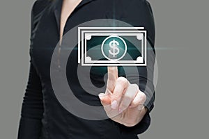 Businesswoman presses digital interface dollar sign
