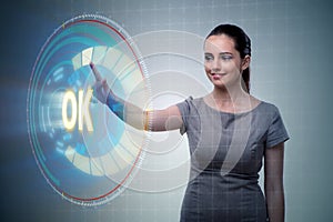 The businesswoman pressing virtual button ok