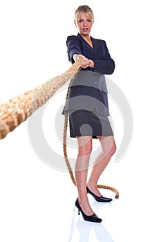 Businesswoman pulling on a rope