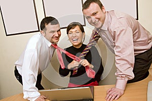 Businesswoman pulling ties