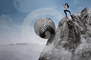 Businesswoman pulls persistence word on the mountain photo