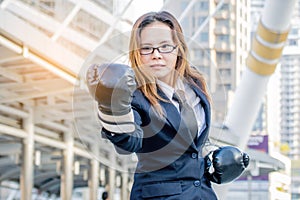 Businesswoman punching in the city