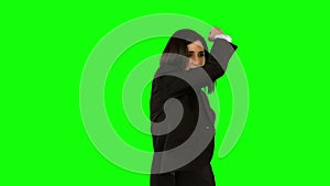 Businesswoman punching on green screen