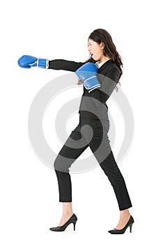 Businesswoman punching and hitting standing