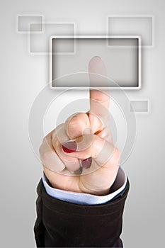 Businesswoman pushing button with finger