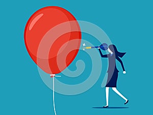 Businesswoman pushing a needle to poke a balloon. business risk concept or dangerous situation