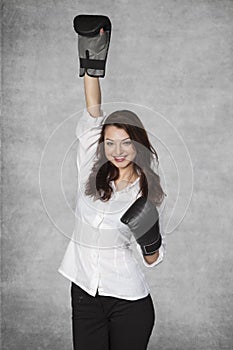 Businesswoman raises hand up, gesture of victory