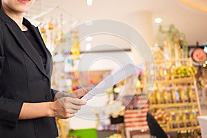 Businesswoman reading a business document.