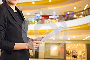 Businesswoman reading a business document.