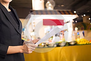 Businesswoman reading a business document.