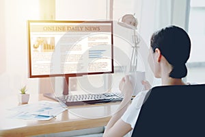 Businesswoman Reading News On Computer