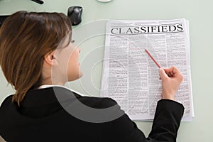 Businesswoman Reading Newspaper