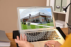 Businesswoman or real estate agent looking through online property portfolio